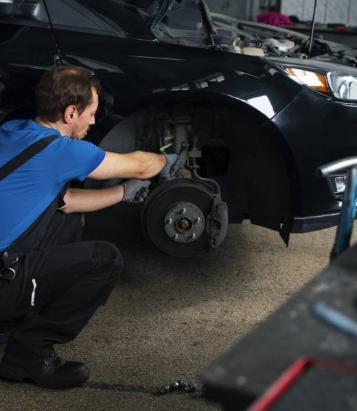 male-mechanic-working-auto-repair-shop-car